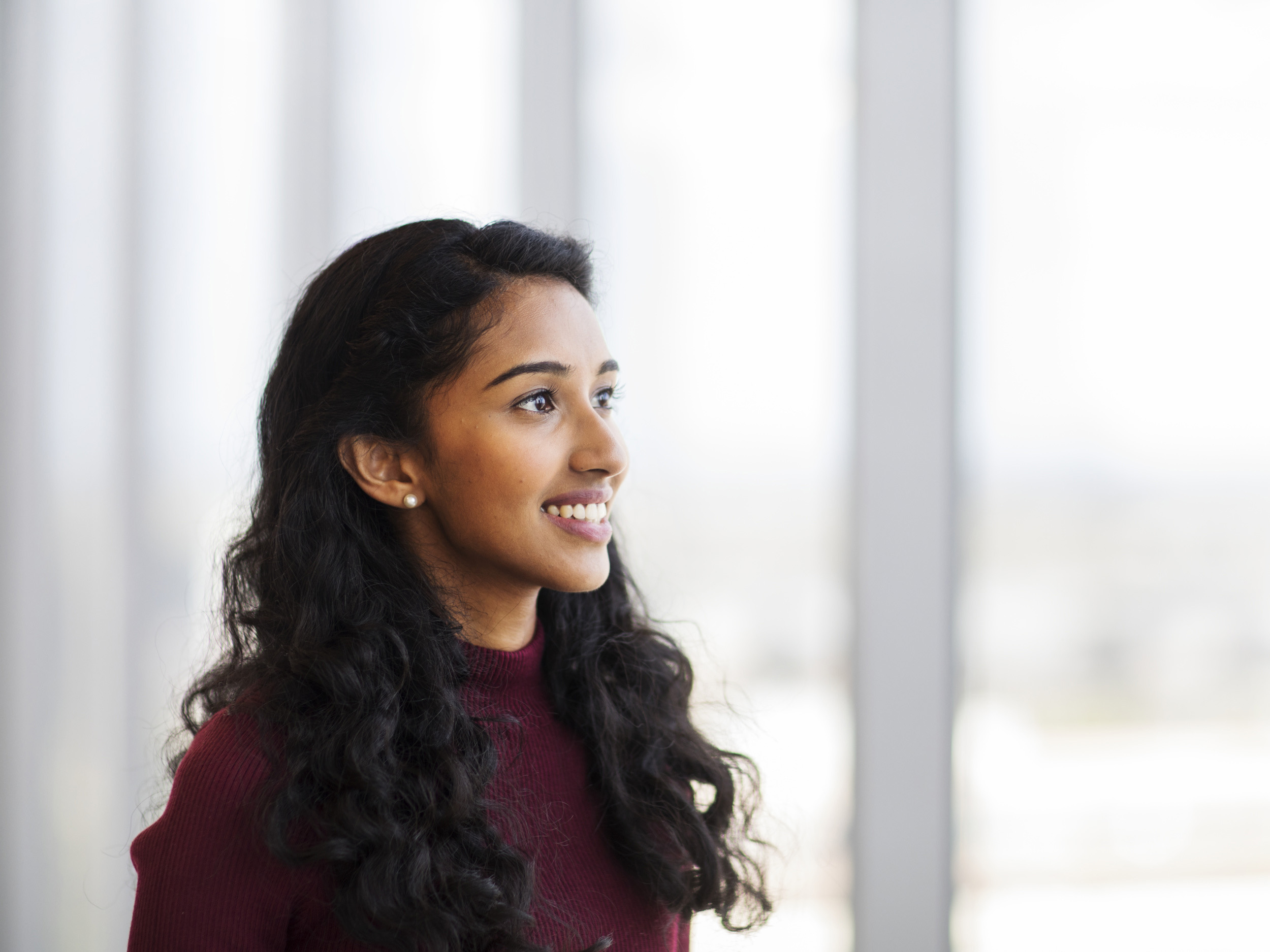 Western Sydney University International Student wearing a purple jumper.