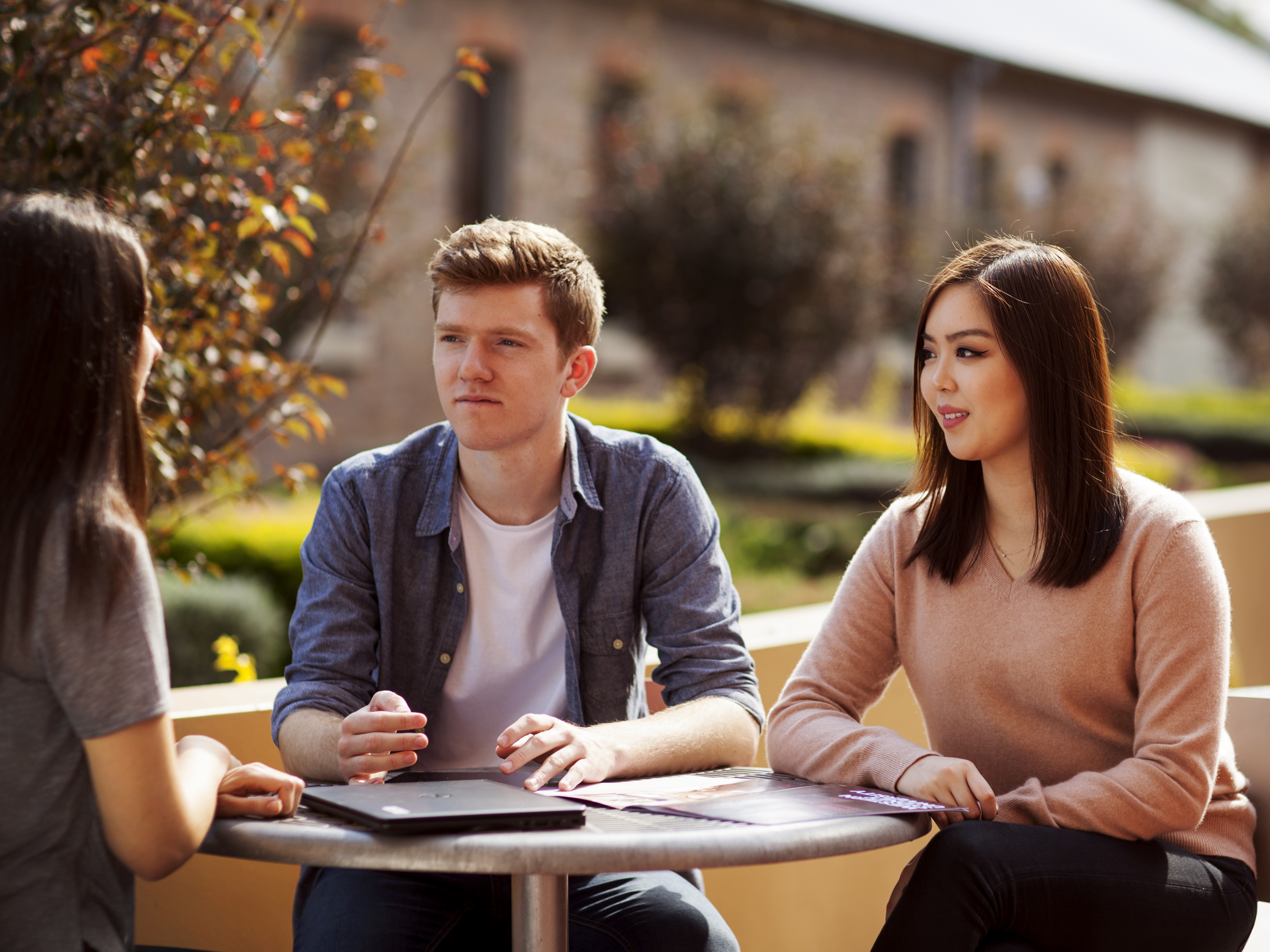 students talking on campus